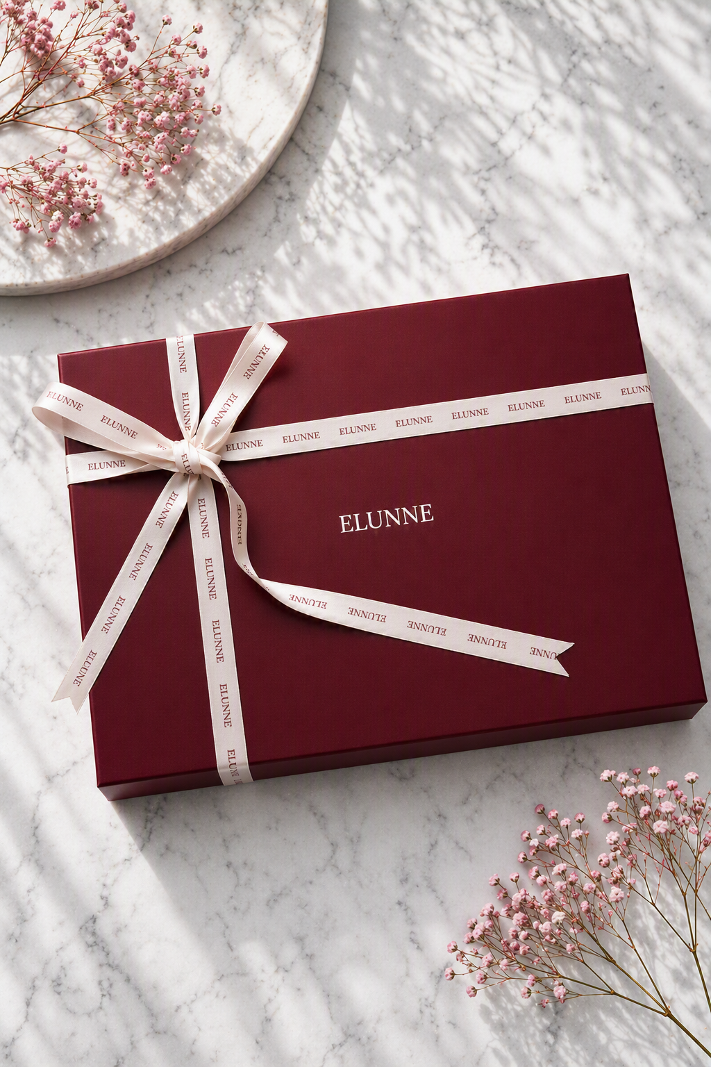 Elunne's signature packaging- closed box with ribbon tied