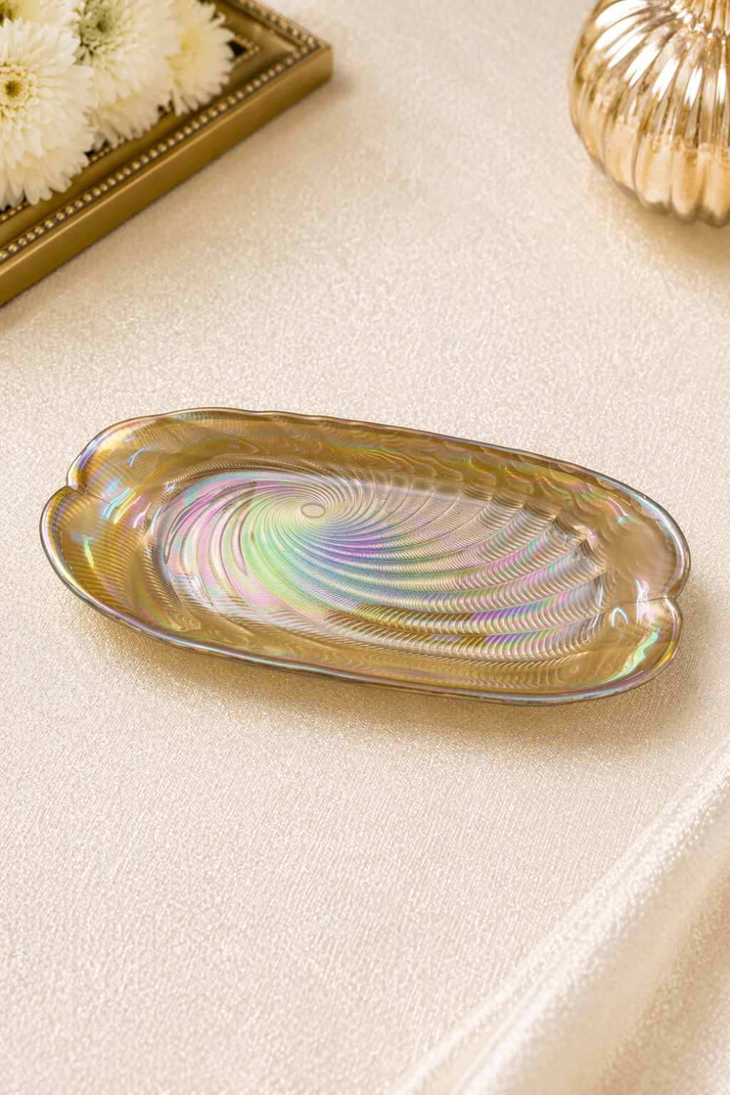 Elunne Satin Dusk sculpted gold bowl catching light — top view