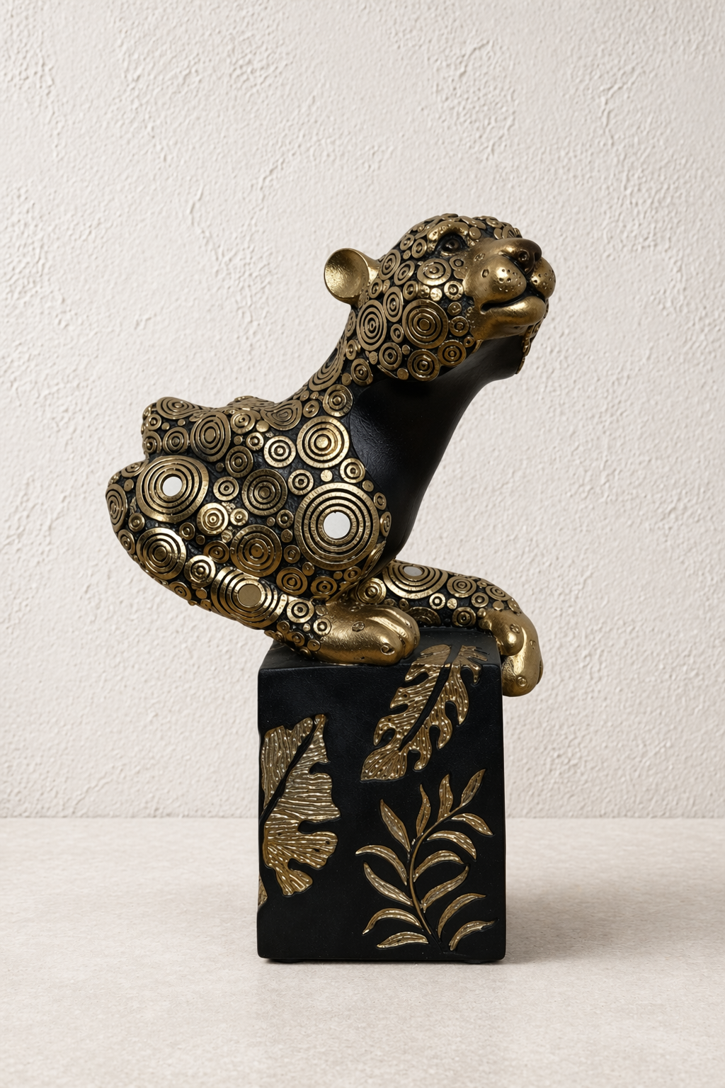 Regal Drift black and gold panther statue by Elunne — front view