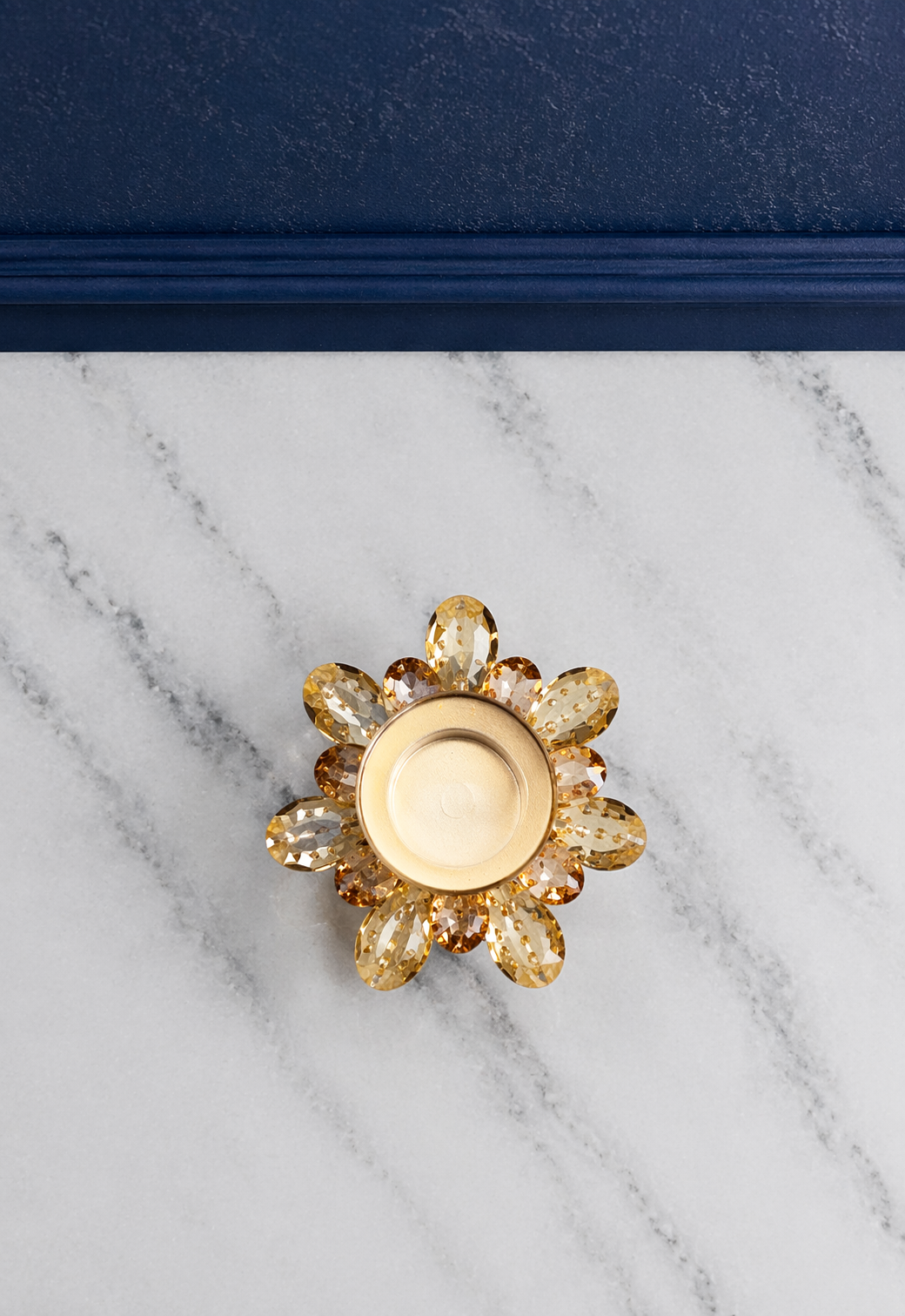 Elunne Aurelia Bloom large amber glass candle holder — warm glow top view