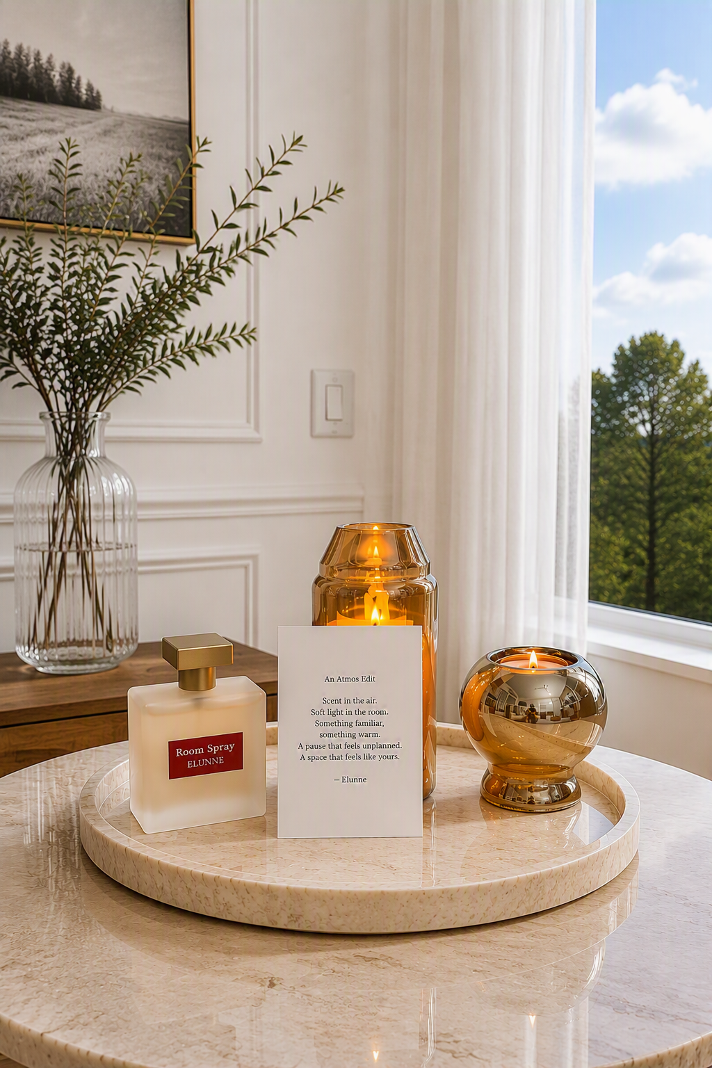 Atmos edit- LED candle, room spray, tea light candle holder and the Atmos Edit note placed in a beautiful cosy ambience